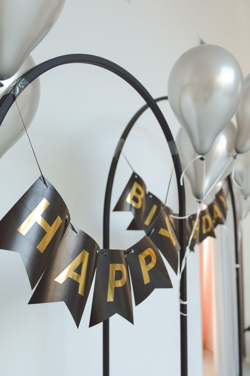 Balloon and floral decoration setup for a birthday party