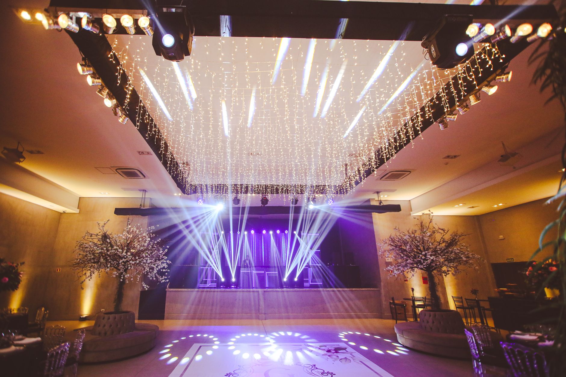 Decorated wedding reception stage with lighting