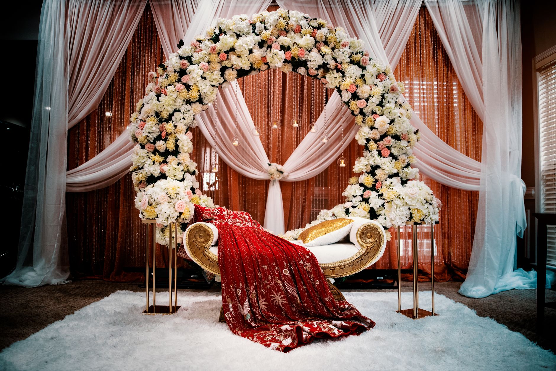 Grand South Indian wedding stage decorated with flowers and lights